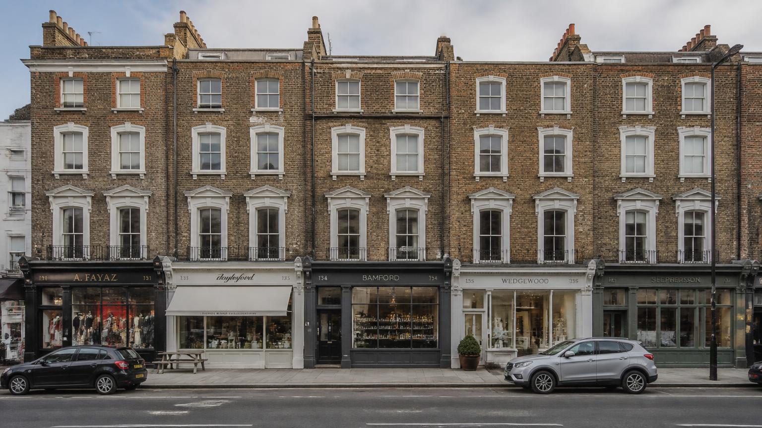 Period London brick terrace of the type in the City Deal Estates portfolio, with commercial units at street level and converted flats above