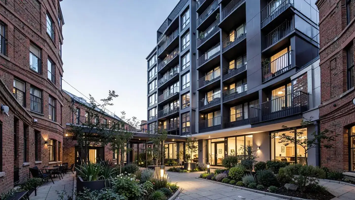 Modern build-to-rent apartment building with a landscaped courtyard entrance