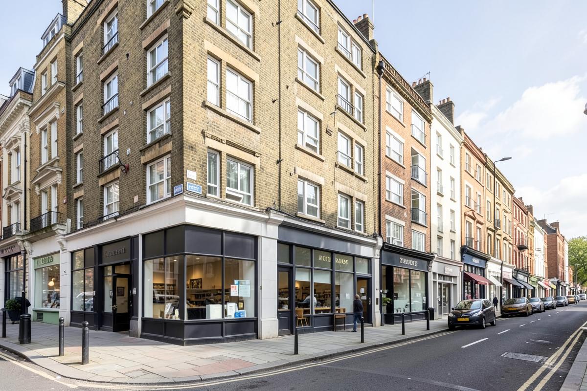 Mixed-use London building with commercial units below and flats above